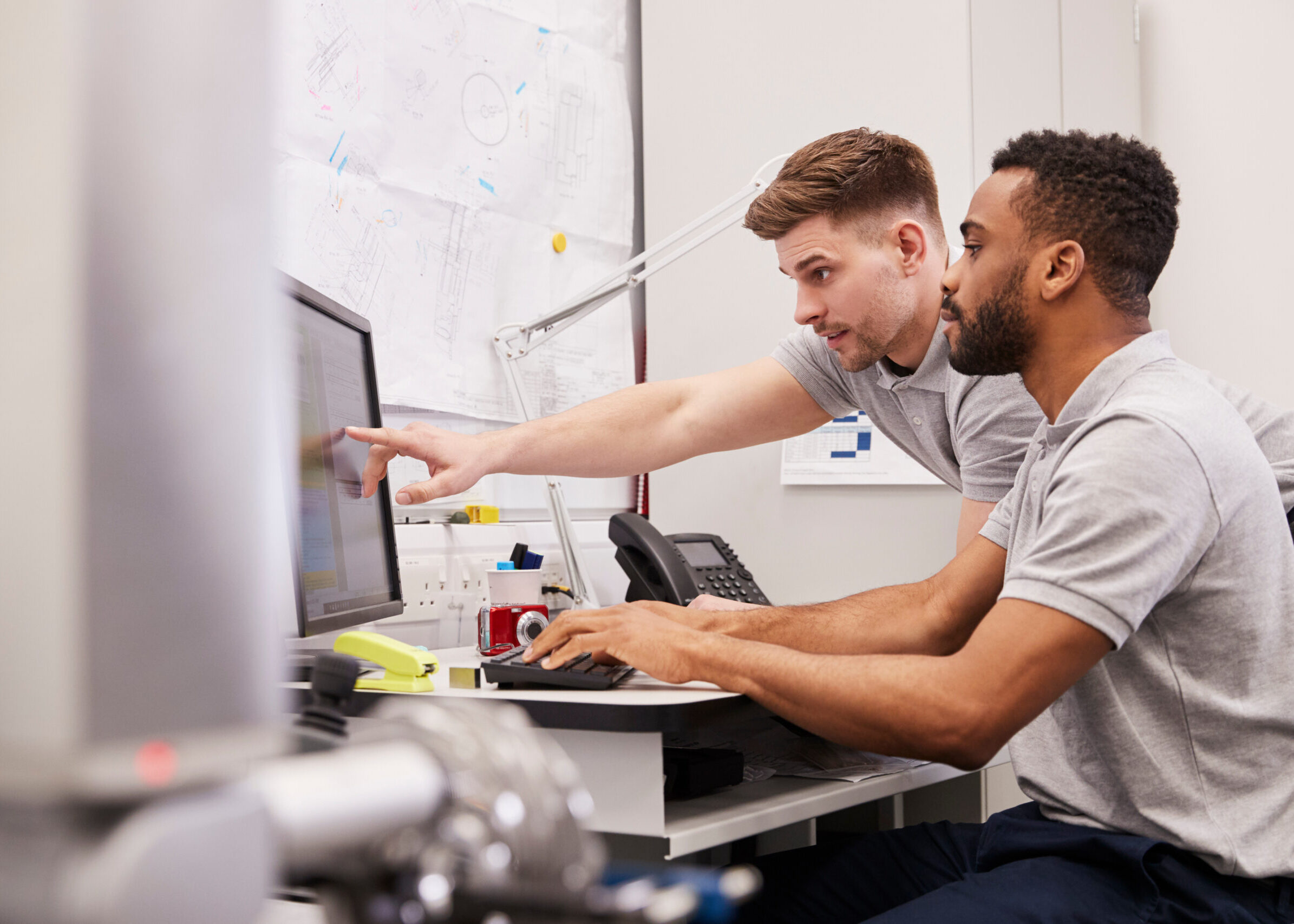 Male Engineers Use CMM Coordinate Measuring Machine In Factory