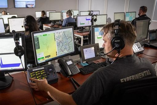 Man looking at a screen in a control room — Applied CAx Siemens aerospace software